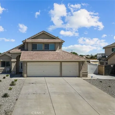 Rent this 4 bed house on 4337 Serene Avenue in Quartz Hill, CA 93536