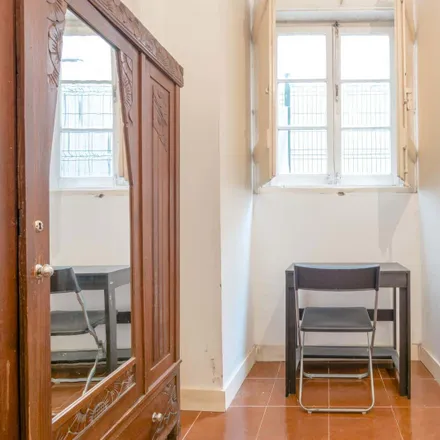 Rent this 4 bed room on Tapa Bucho in Rua dos Mouros 19, 1200-385 Lisbon