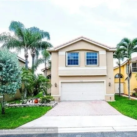 Buy this 4 bed house on 5332 Nw 117th Ave in Coral Springs, Florida