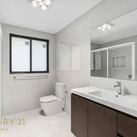 Rent this 4 bed apartment on Kingsford Smith Avenue in Middleton Grange NSW 2171, Australia