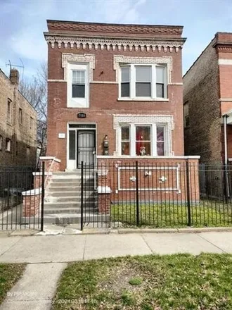 Rent this 3 bed house on 7125 South Doctor Martin Luther King Junior Drive in Chicago, IL 60621