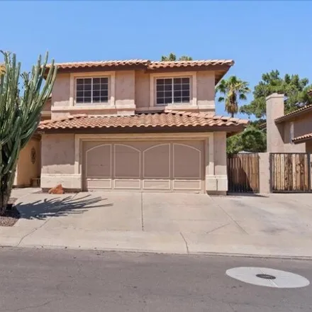 Rent this 4 bed house on 7524 West Tonto Drive in Glendale, AZ 85308