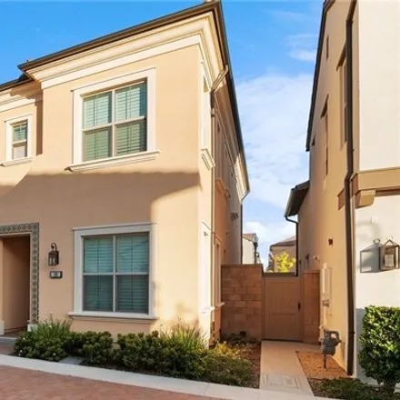 Rent this 4 bed condo on 108 Trumpet Flower in Irvine, CA 92618