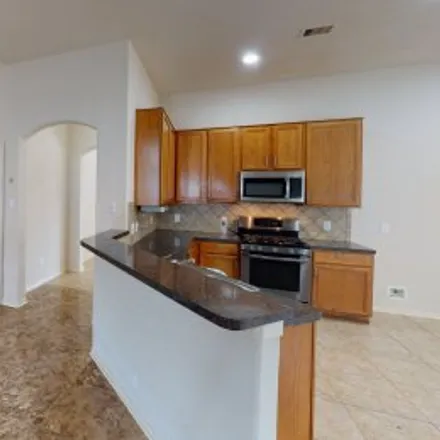 Rent this 3 bed apartment on 4926 Hackamore Brook Court in Ricewood Village, Katy