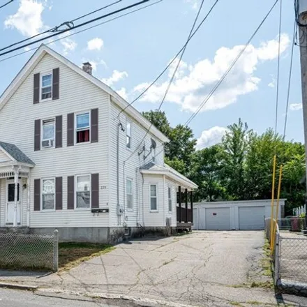 Buy this 5 bed townhouse on 228 Ludlam Street in Lowell, MA 01850