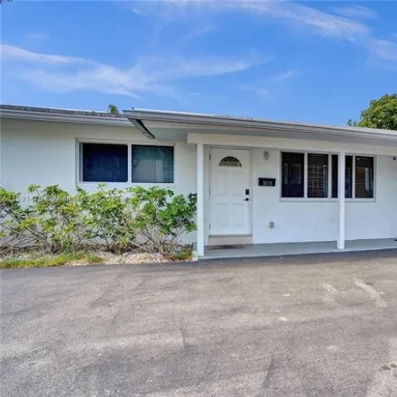 Buy this 5 bed house on 3049 Northeast 16th Avenue in Coral Woods, Oakland Park