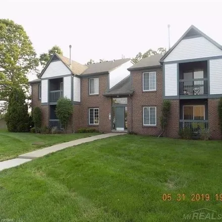 Rent this 2 bed condo on Gardner-White Furniture in Ashley Court, Macomb Township