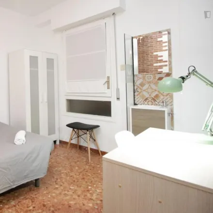 Rent this 22 bed room on Parròquia de Nostra Senyora del Carme in Carrer de Roger de Llúria, 08001 Barcelona