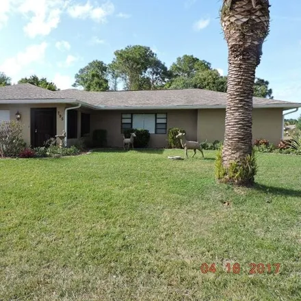 Rent this 4 bed house on 706 Alaska Avenue Northeast in Palm Bay, FL 32907