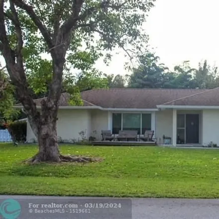 Rent this 3 bed house on Hemlock Greenway in Southeast Golden Gate Avenue, Martin County