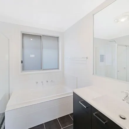 Rent this 4 bed apartment on 19 Jennings Crescent in Spring Farm NSW 2570, Australia