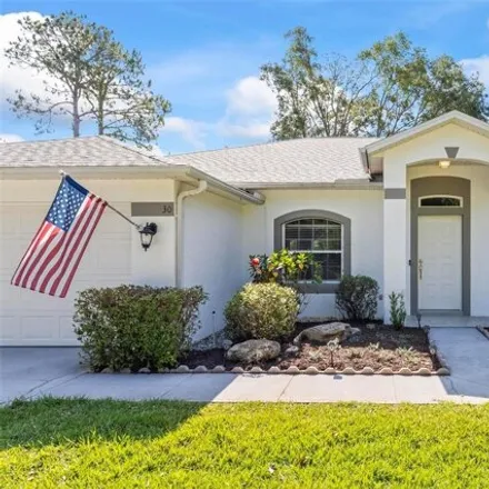 Buy this 4 bed house on 58 Pebble Wood Lane in Palm Coast, FL 32164