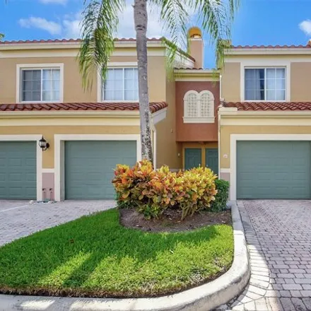 Rent this 2 bed townhouse on 11775 St Andrews Pl Unit 105 in Wellington, Florida