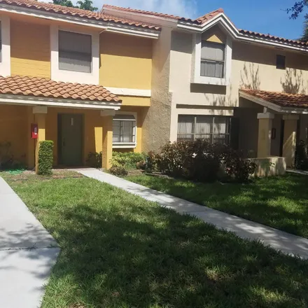 Rent this 2 bed townhouse on 3609 Coral Tree Circle