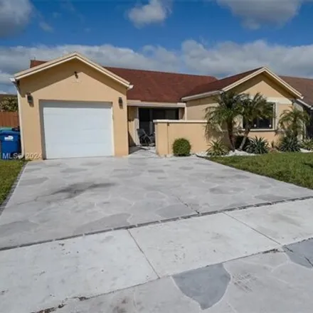 Buy this 4 bed house on 3247 Northwest 203rd Lane in Miami Gardens, FL 33056