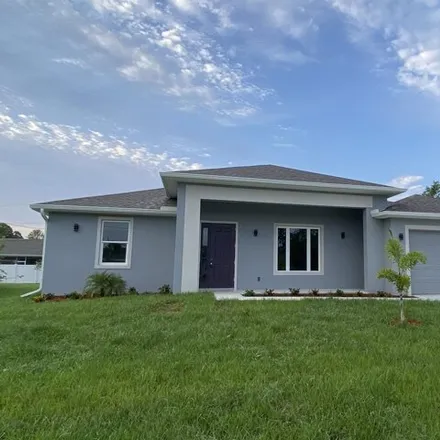 Buy this 4 bed house on 3059 Cambria Avenue Southwest in Palm Bay, FL 32908