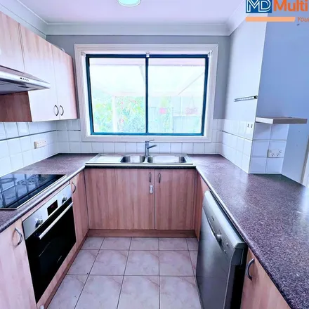 Rent this 3 bed townhouse on Plum Close in Casula NSW 2170, Australia
