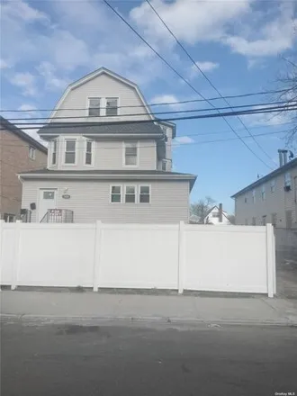 Buy this 6 bed house on 1404 Dickens Street in New York, NY 11691