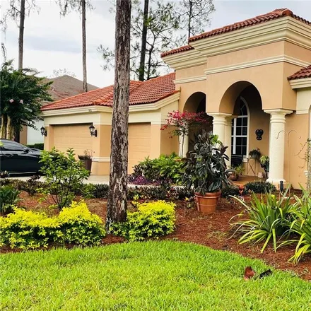 Buy this 5 bed house on 2877 Grey Oaks Boulevard in Palm Harbor, FL 34688