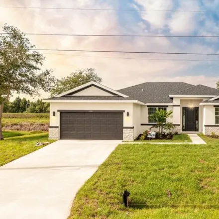 Buy this 4 bed house on 5811 Dooley Circle in Port Saint Lucie, FL 34986