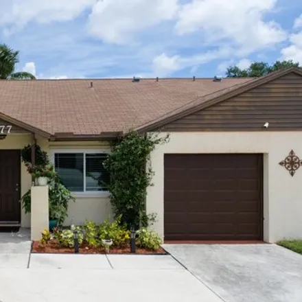 Buy this 3 bed townhouse on 8477 Blue Cypress Dr in Lake Worth, Florida