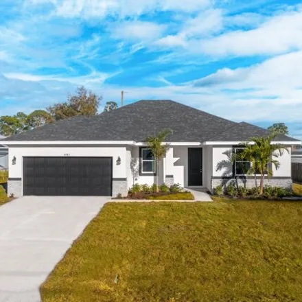 Buy this 4 bed house on 3280 Westover Avenue Southeast in Palm Bay, FL 32909
