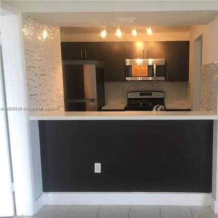 Rent this 2 bed apartment on 7165 Northwest 186th Street in Country Club, Miami-Dade County