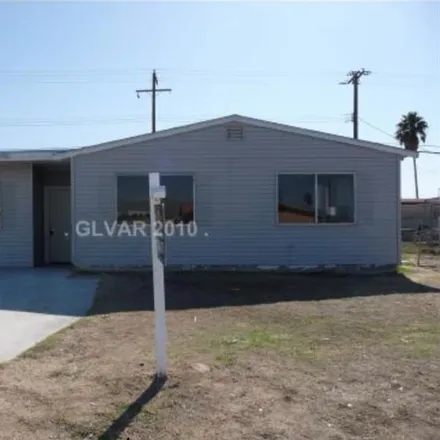 Buy this 4 bed house on 1941 West Cartier Avenue in North Las Vegas, NV 89032
