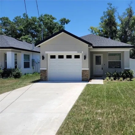 Rent this 3 bed house on 1904 Virginia Avenue in Eustis, FL 32727