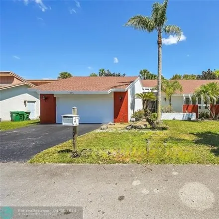 Buy this 3 bed house on Woodmont Country Club in 7801 Northwest 80th Avenue, Tamarac