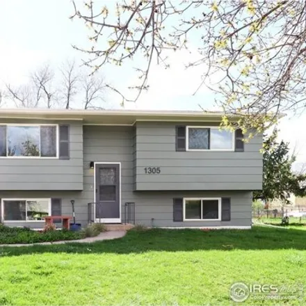 Buy this 4 bed house on 1317 Village Lane in Fort Collins, CO 80521