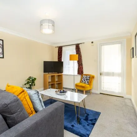 Rent this 2 bed townhouse on Pheasant Close in Custom House, London