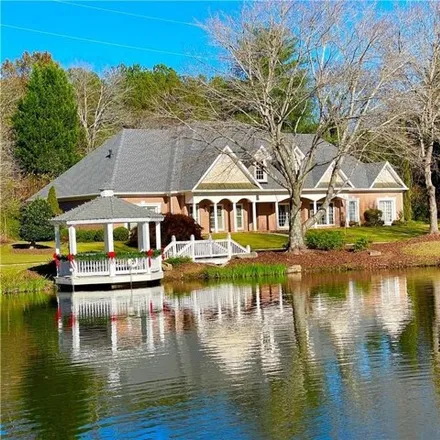 Buy this 4 bed house on 6015 East Andechs Summit in Johns Creek, GA 30097