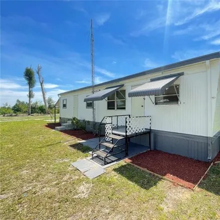 Buy this studio apartment on 5916 Sabalwood Drive in Charlotte County, FL 33982