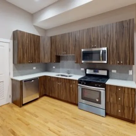 Rent this 4 bed apartment on #102,3431 South Indiana Avenue in Ickes Praire, Chicago