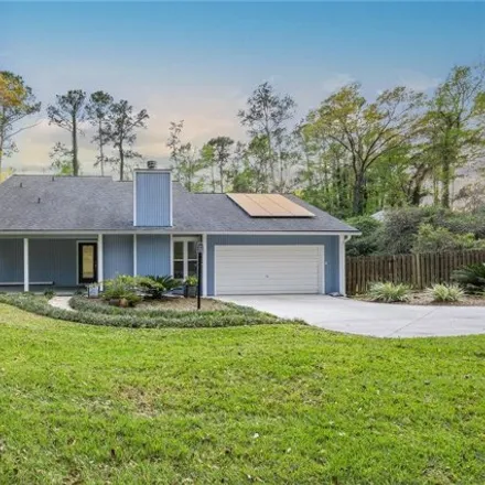 Buy this 4 bed house on 6501 Northwest 28th Place in Alachua County, FL 32606