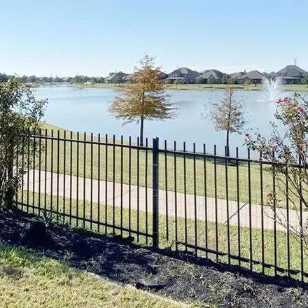 Rent this 4 bed apartment on 8803 East Windhaven Terrace Trail in Harris County, TX 77433