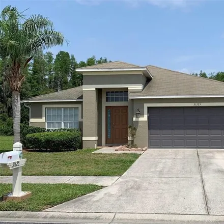 Rent this 4 bed house on 31327 Kirkshire Court in Pasco County, FL 33543