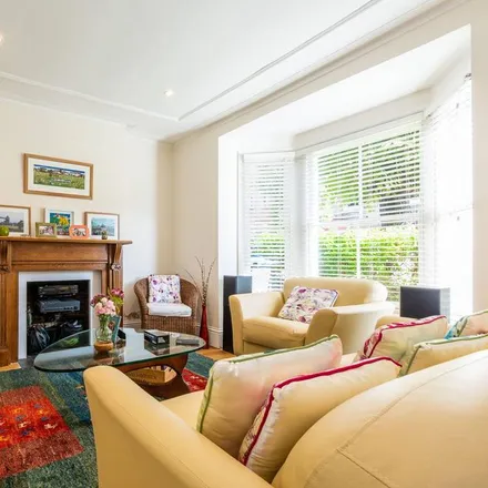 Rent this 4 bed townhouse on Courthope Villas in London, SW19 4EH