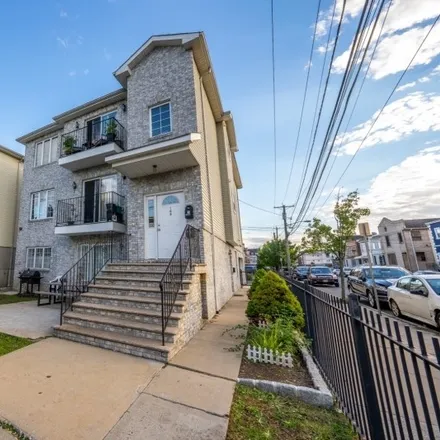 Buy this 8 bed townhouse on 161 Berkeley Avenue in Newark, NJ 07107