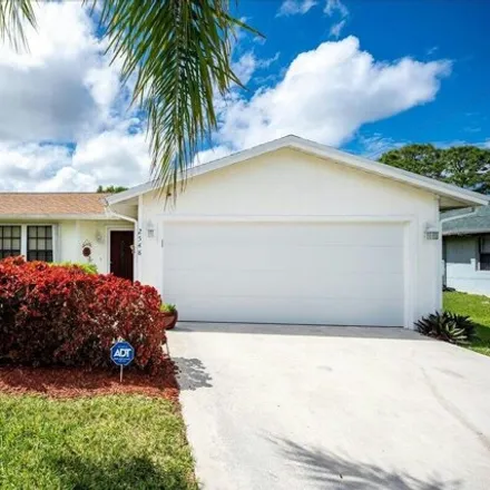 Buy this 3 bed house on 2551 Southwest Appleby Street in Port Saint Lucie, FL 34984