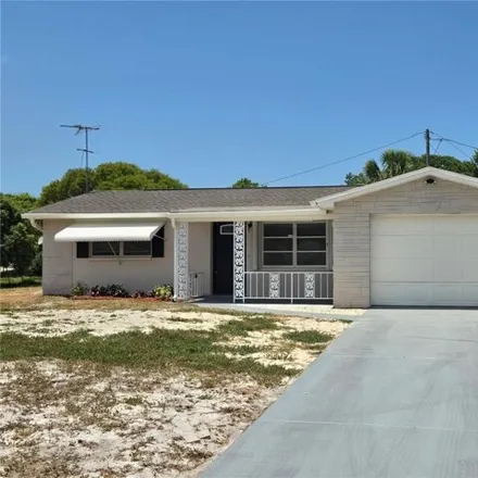 Buy this 3 bed house on 7277 Coventry Drive in Bayonet Point, FL 34668