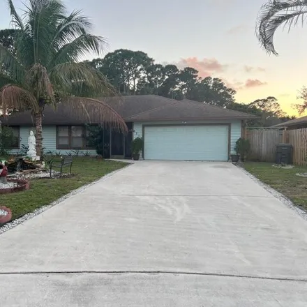 Rent this 4 bed house on 6791 Lawrence Woods Ct in Lake Worth, Florida