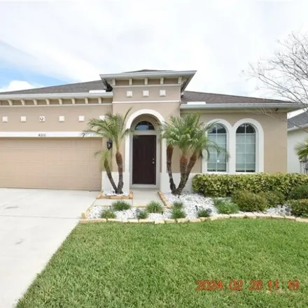 Rent this 4 bed house on 4198 Windcrest Drive in Seven Oaks, Pasco County