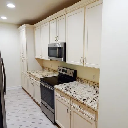 Rent this 4 bed apartment on 8065 Bristol Circle in Collier County, FL 34120