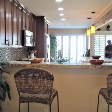 Rent this 2 bed apartment on 48594 Desert Flower Drive in Palm Desert, CA 92260