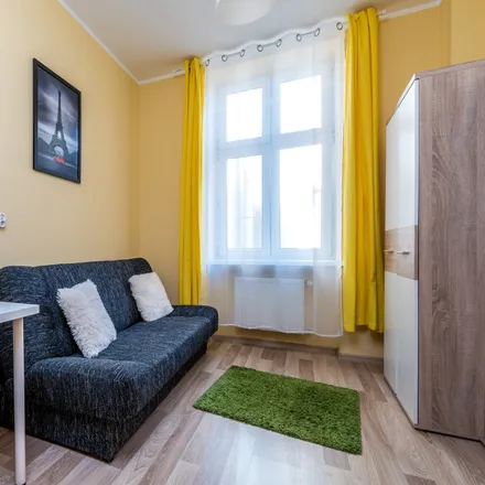 Rent this 5 bed room on Święty Marcin 76 in 61-809 Poznań, Poland