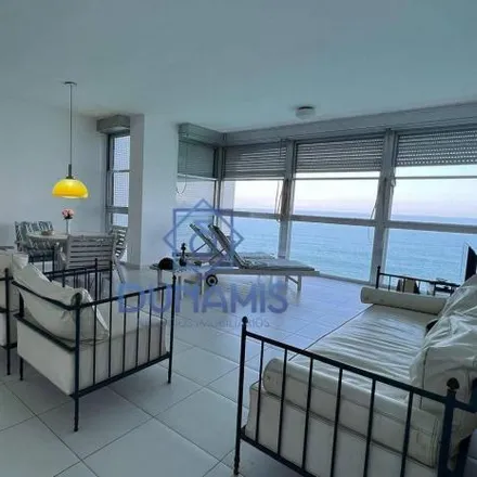 Buy this 2 bed apartment on unnamed road in Vila Alice, Guarujá - SP