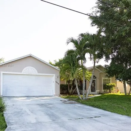 Buy this 3 bed house on 5458 NW Empress Cir in Port Saint Lucie, Florida