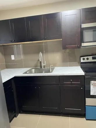Rent this 2 bed condo on 305 West 68th Street in Hialeah, FL 33014